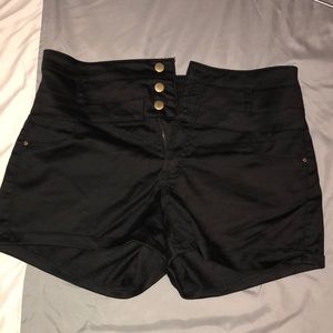 Black shorts/gold buttons